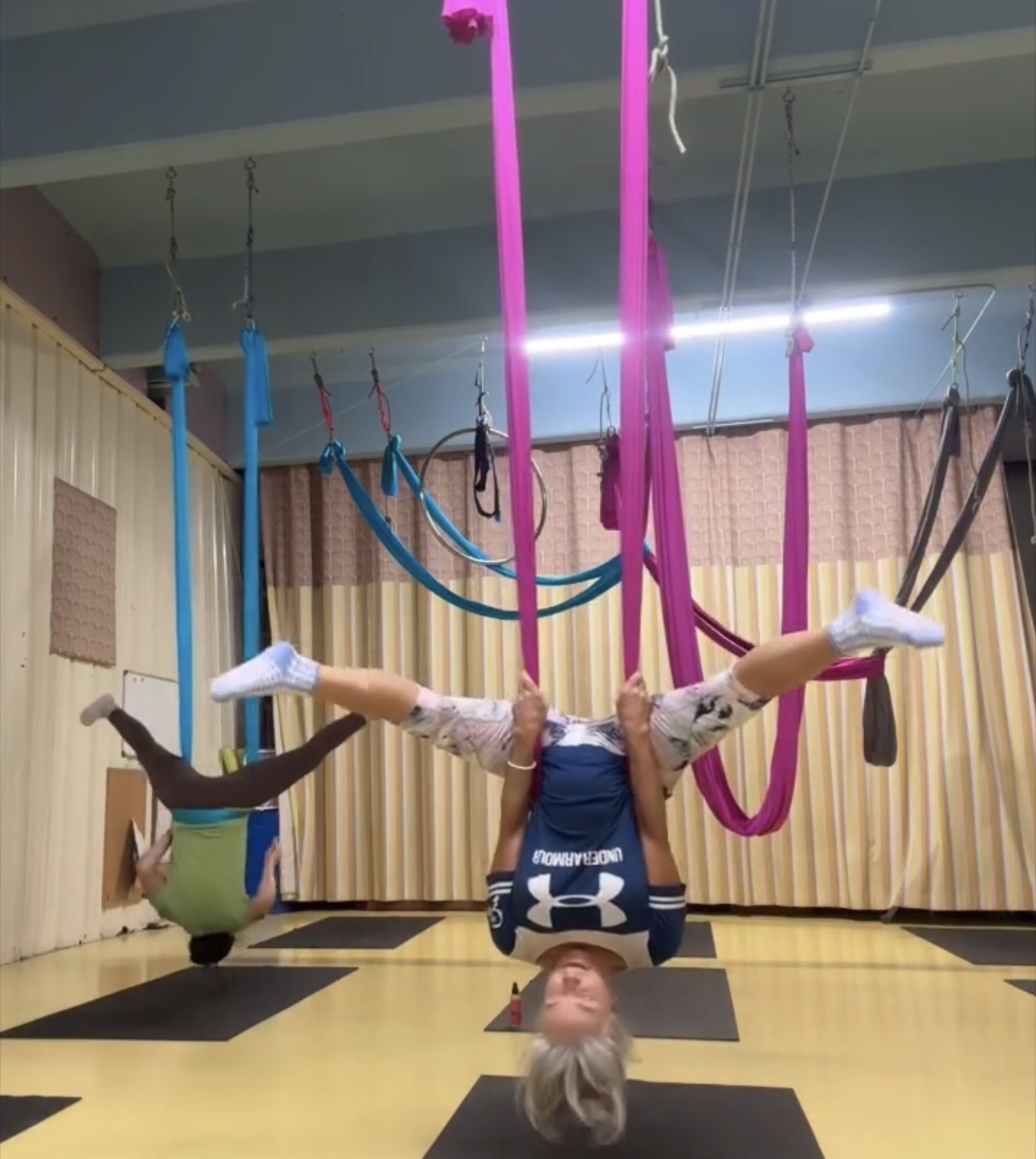 Guests enjoying an aerial yoga class at Clean Camp